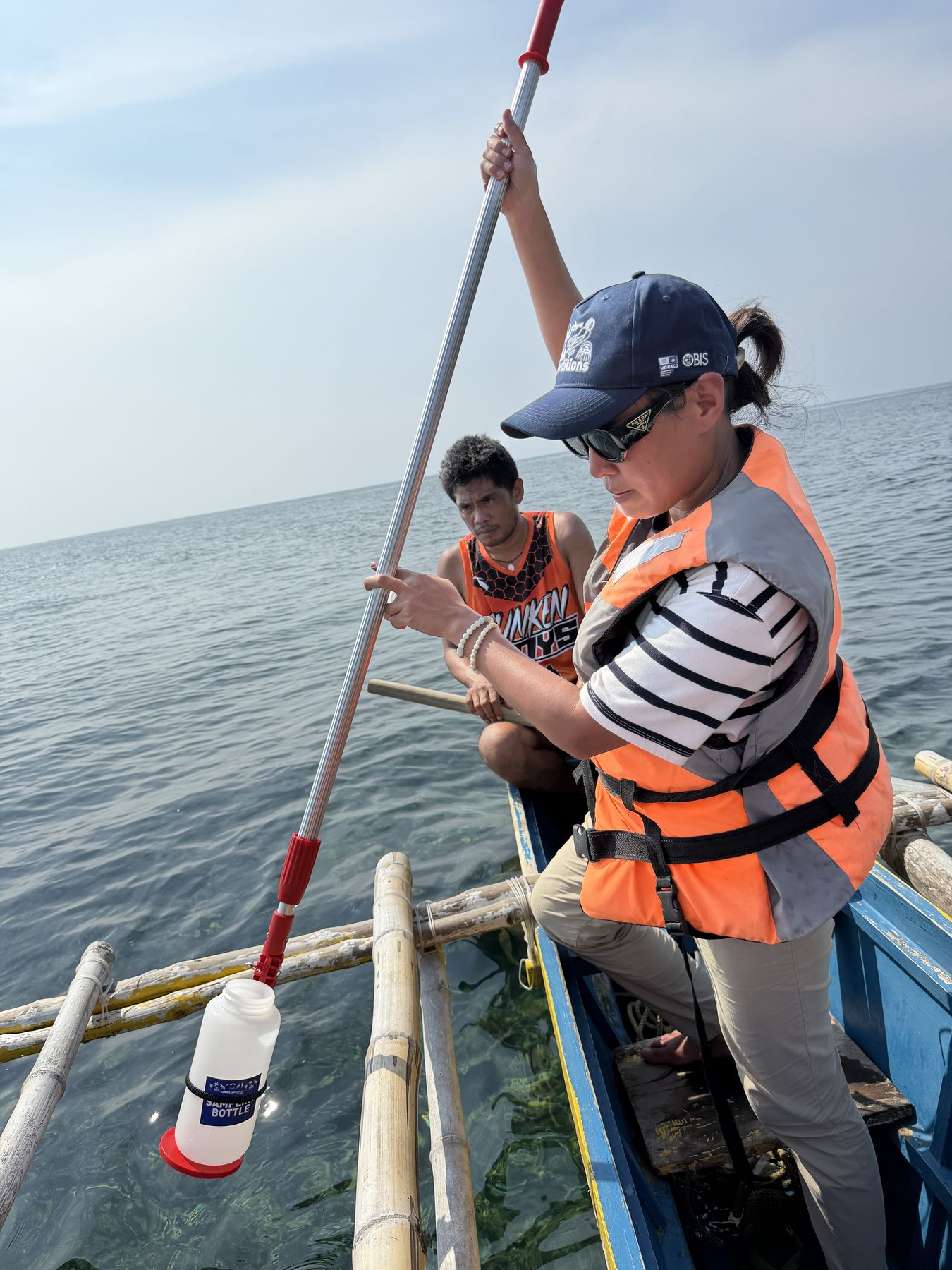 Water sampling under the expert glance of a Bantay Dagat at Sunken Cemetery. Camiguin Island, Philippines, September 2026.